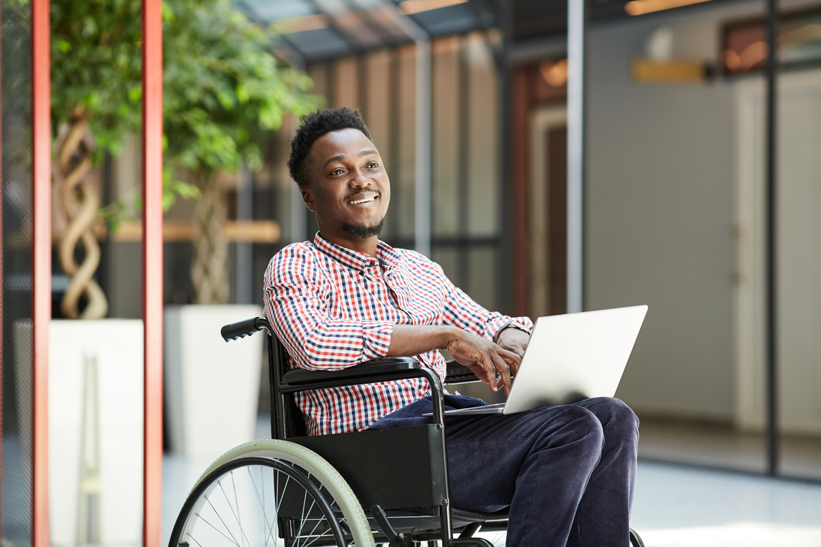Disabled man using laptop